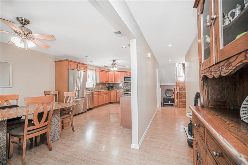 Dining room, Interior, Kitchen, Recessed Lighting, Stainless Steel Appliances, Wood Texture Flooring