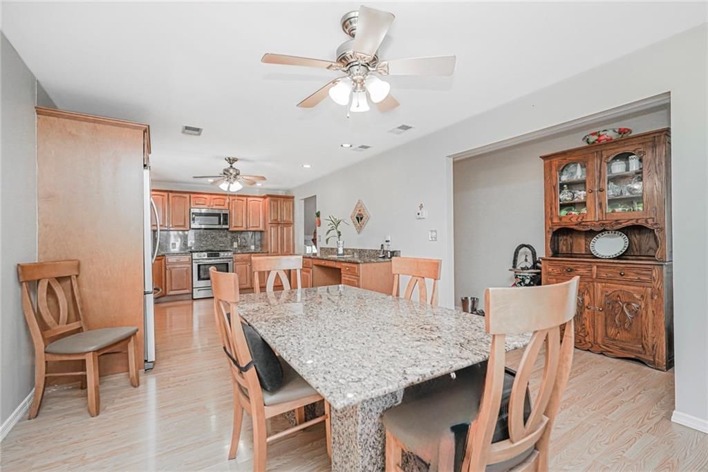 Dining room, Interior, Kitchen, Recessed Lighting, Stainless Steel Appliances, Wood Texture Flooring