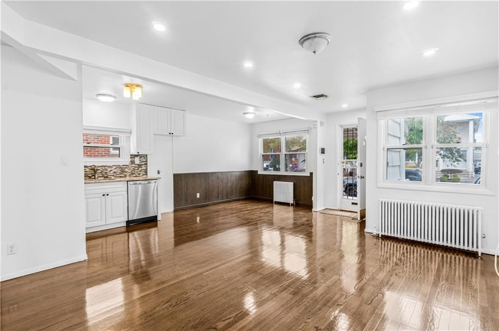 Empty room, Interior, Kitchen, Recessed Lighting, Stainless Steel Appliances, Wood Texture Flooring