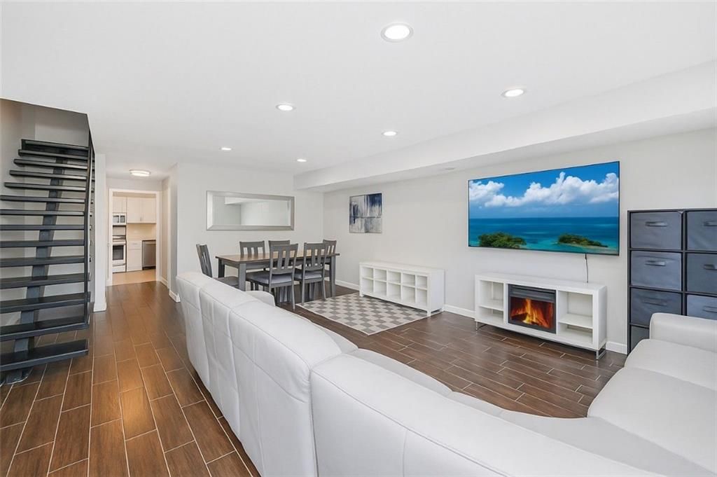 Dining room, Fireplace, Interior, Living room, Recessed Lighting, Water, Wood Texture Flooring