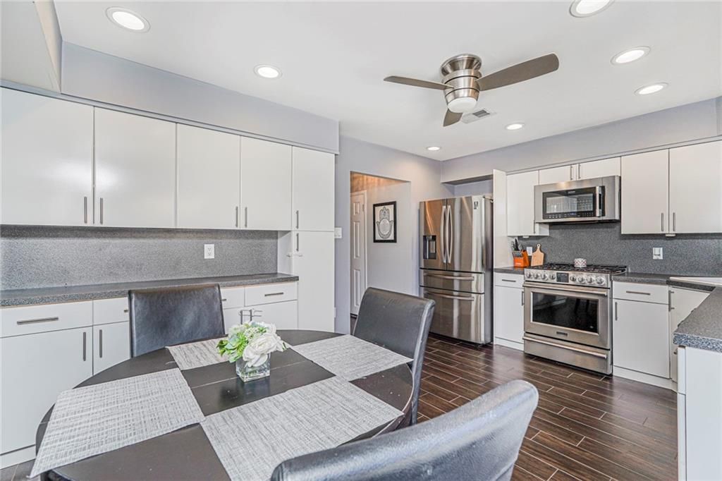 Dining room, Interior, Kitchen, Recessed Lighting, Stainless Steel Appliances, Wood Texture Flooring