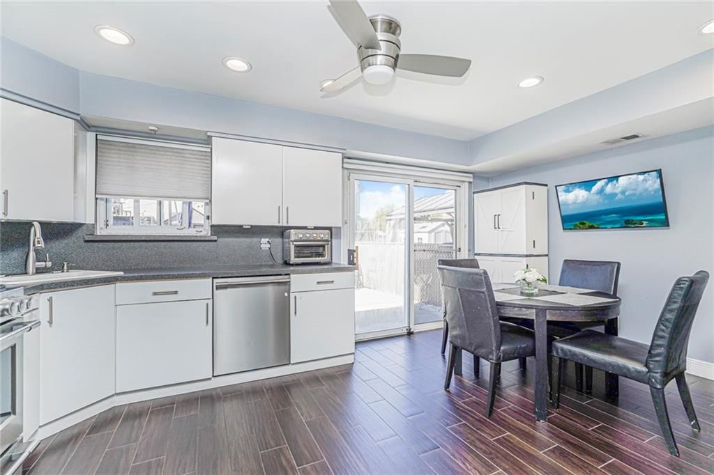 Dining room, Interior, Kitchen, Recessed Lighting, Stainless Steel Appliances, Wood Texture Flooring
