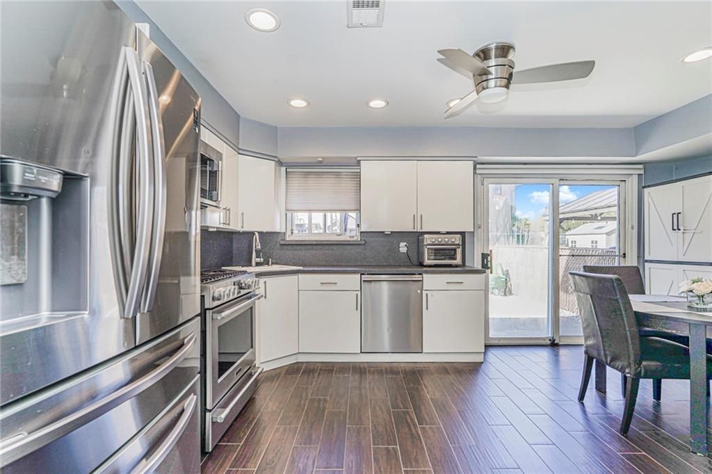 Dining room, Interior, Kitchen, Recessed Lighting, Stainless Steel Appliances, Wood Texture Flooring