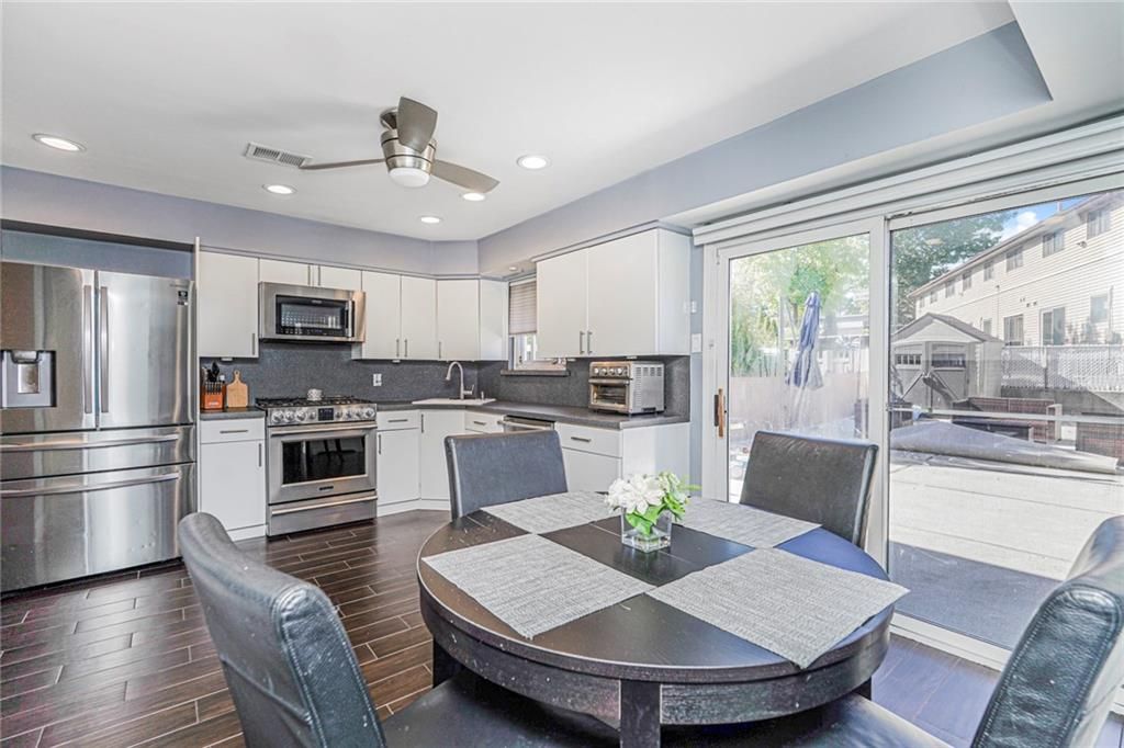 Dining room, Interior, Kitchen, Recessed Lighting, Stainless Steel Appliances, Wood Texture Flooring
