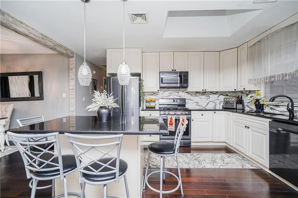 Interior, Kitchen, Marble Walls, Pendant Lights, Stainless Steel Appliances, Wood Texture Flooring
