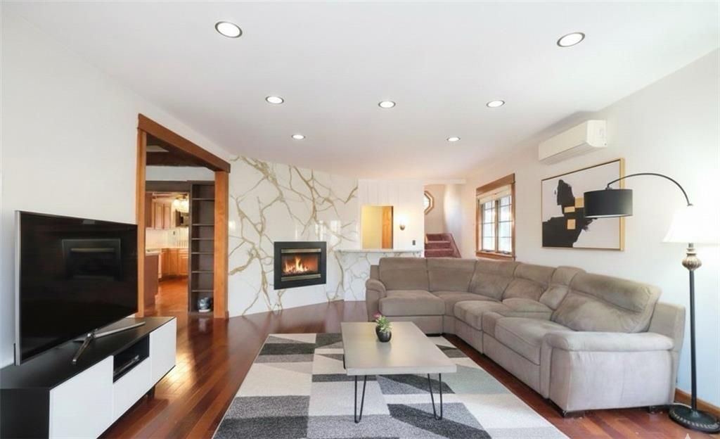 Fireplace, Interior, Living room, Marble Walls, Recessed Lighting, Wood Texture Flooring