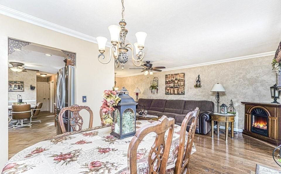 Chandelier, Dining room, Fireplace, Interior, Living room, Recessed Lighting, Stone Walls, Wood Texture Flooring