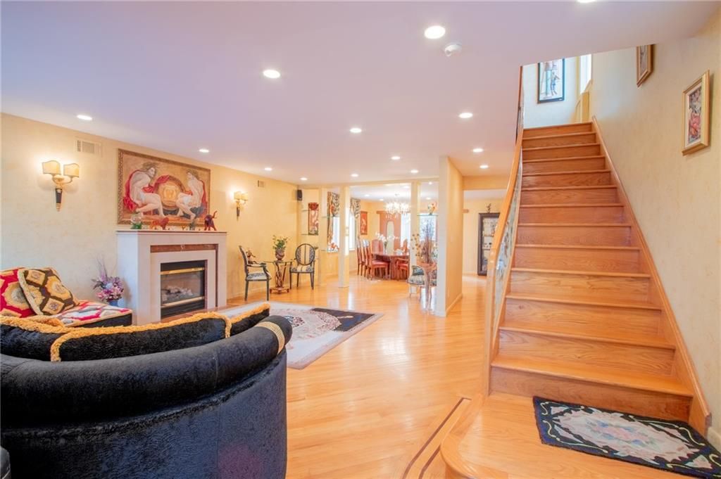 Dining room, Fireplace, Interior, Living room, Recessed Lighting, Wood Texture Flooring