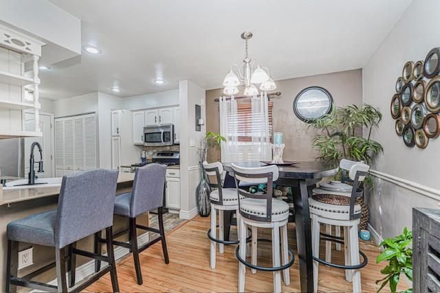 Chandelier, Dining room, Interior, Kitchen, Recessed Lighting, Stainless Steel Appliances, Wood Texture Flooring