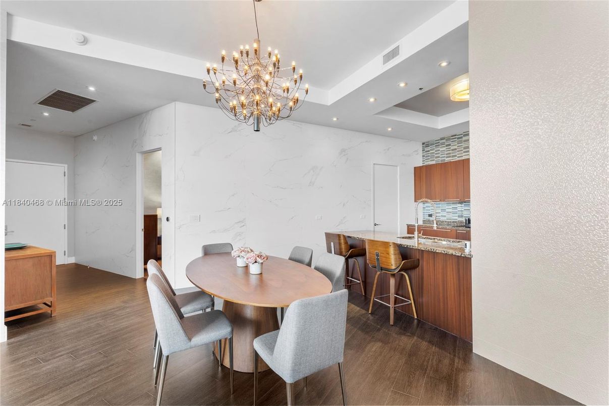 Chandelier, Dining room, Interior, Kitchen, Marble Walls, Pendant Lights, Recessed Lighting, Wood Texture Flooring