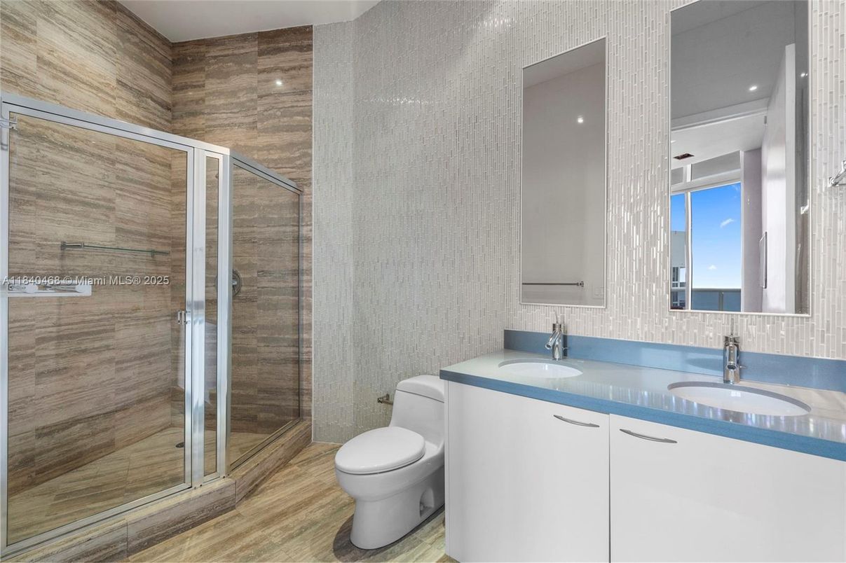 Bathroom, Dual Sink Vanities, Glass Shower, Interior, Recessed Lighting, Wood Texture Flooring