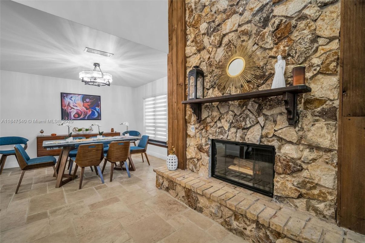 Chandelier, Dining room, Fireplace, Interior, Stone Walls