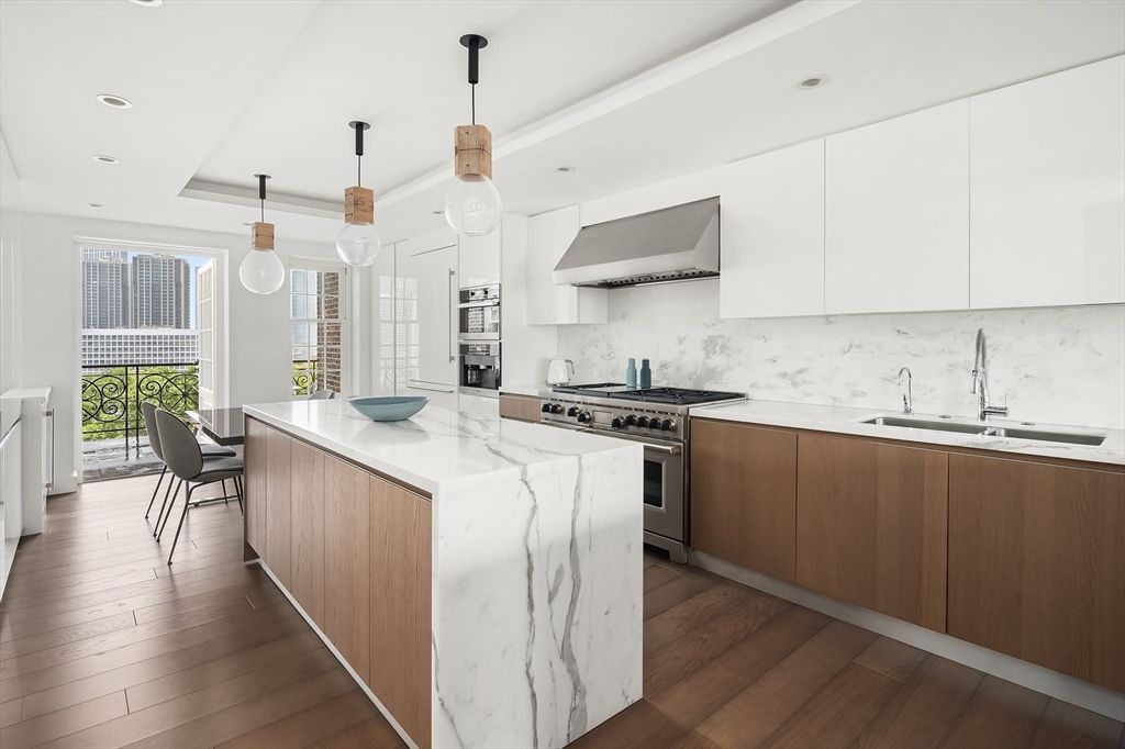 Interior, Kitchen, Marble Walls, Pendant Lights, Recessed Lighting, Stainless Steel Appliances, Wood Texture Flooring