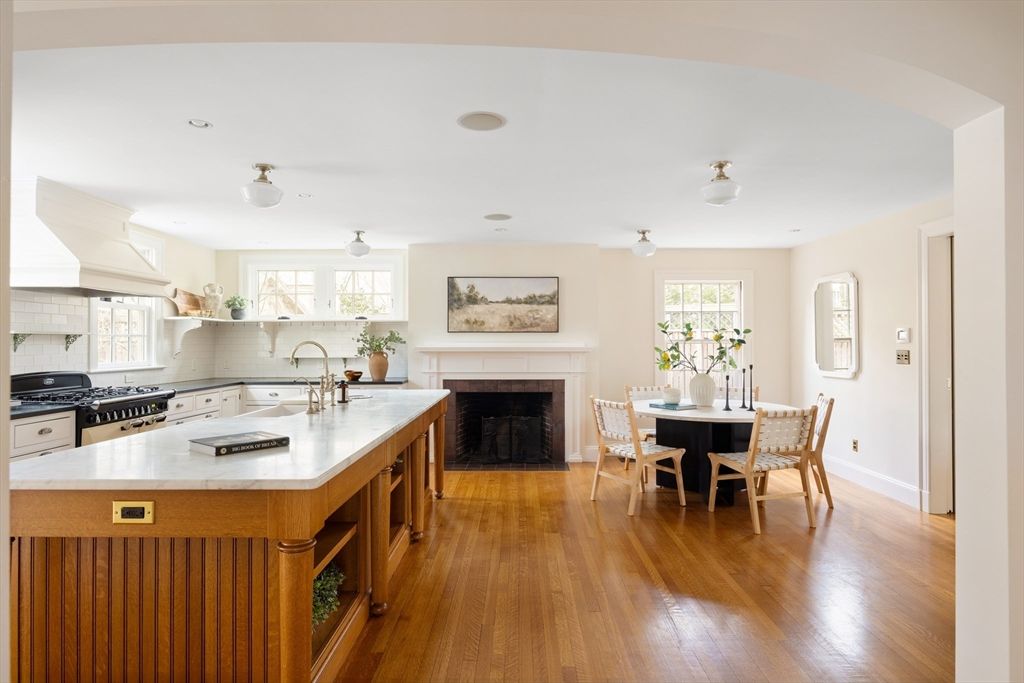 Dining room, Fireplace, Interior, Kitchen, Stainless Steel Appliances, Wood Texture Flooring