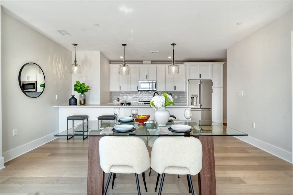 Dining room, Interior, Kitchen, Pendant Lights, Recessed Lighting, Stainless Steel Appliances, Wood Texture Flooring