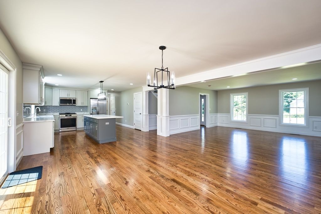Empty room, Interior, Kitchen, Pendant Lights, Recessed Lighting, Stainless Steel Appliances, Wood Texture Flooring