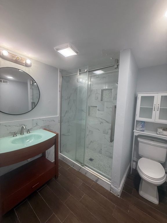 Bathroom, Glass Shower, Interior, Marble Walls, Wood Texture Flooring