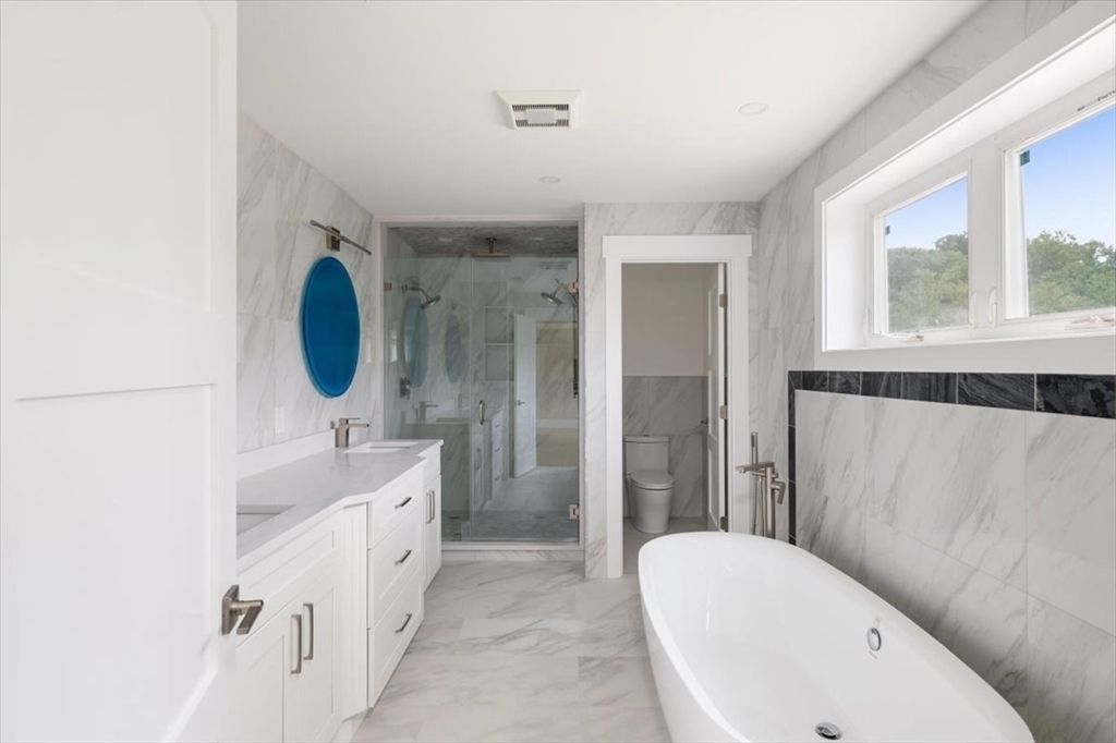 Bathroom, Dual Sink Vanities, Free Standing Baths, Glass Shower, Interior, Marble, Marble Walls, Recessed Lighting