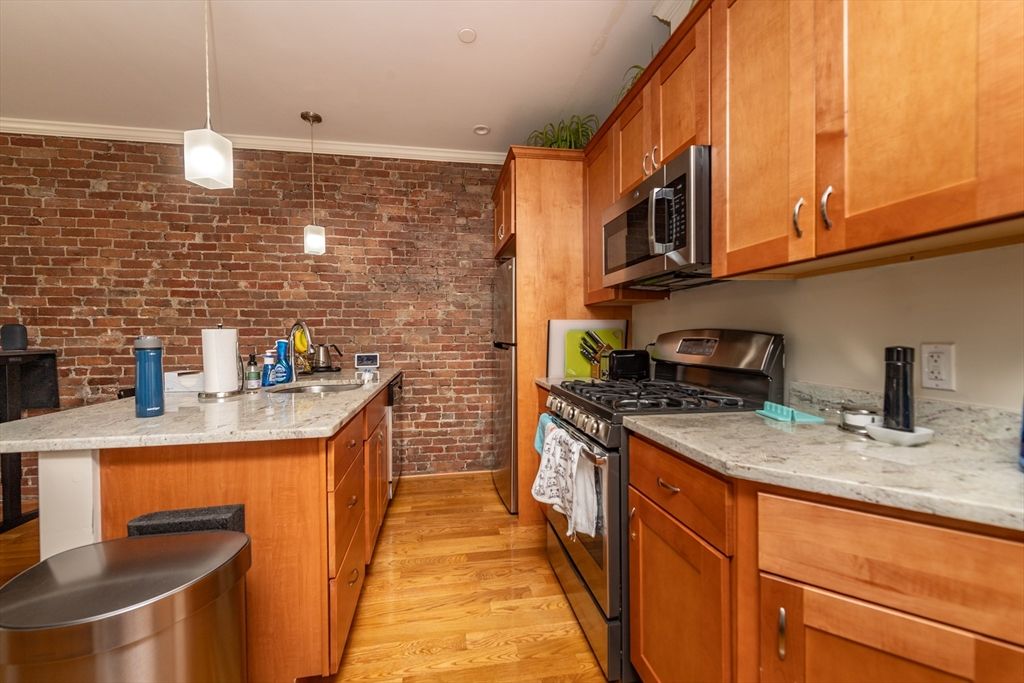 Interior, Kitchen, Pendant Lights, Stainless Steel Appliances, Stone Walls, Wood Texture Flooring