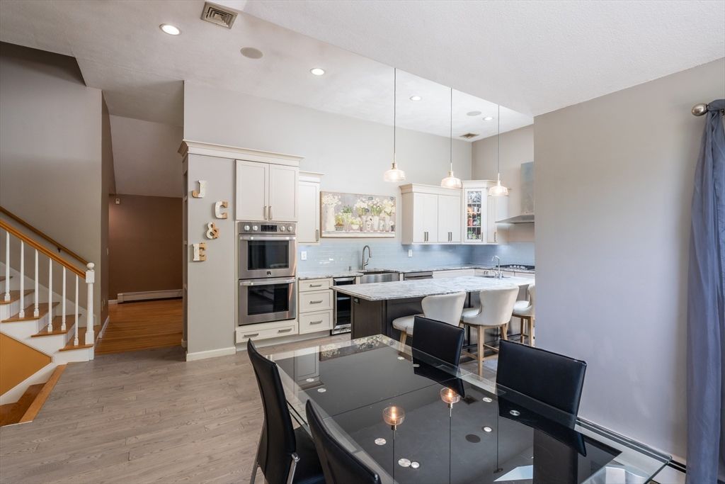 Dining room, Interior, Kitchen, Pendant Lights, Recessed Lighting, Stainless Steel Appliances, Wood Texture Flooring