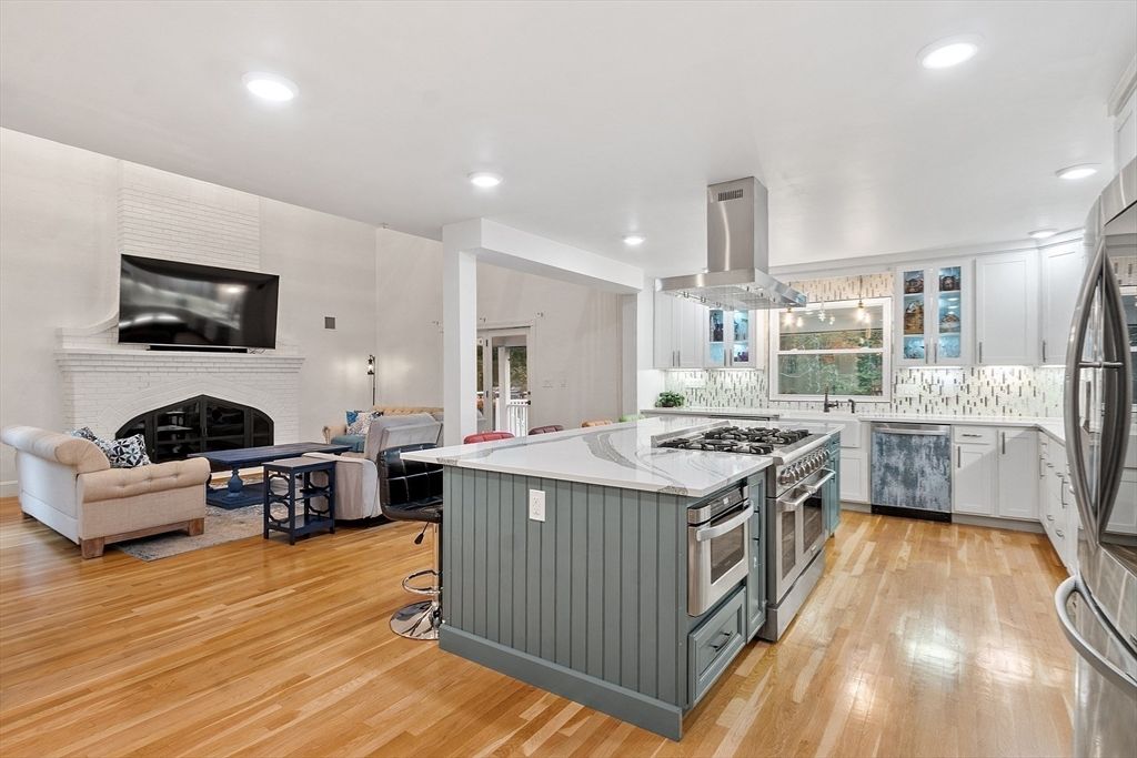 Fireplace, Interior, Kitchen, Living room, Recessed Lighting, Stainless Steel Appliances, Wood Texture Flooring
