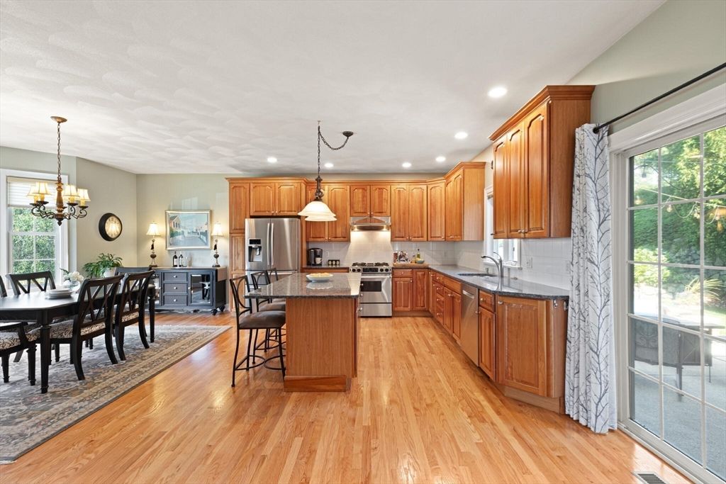Chandelier, Dining room, Interior, Kitchen, Pendant Lights, Recessed Lighting, Stainless Steel Appliances, Wood Texture Flooring