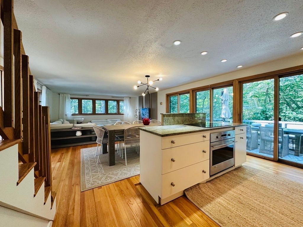 Dining room, Interior, Kitchen, Living room, Recessed Lighting, Stainless Steel Appliances, Wood Texture Flooring