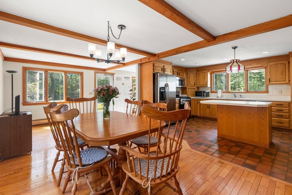 Chandelier, Dining room, Interior, Kitchen, Pendant Lights, Recessed Lighting, Stainless Steel Appliances, Wooden Beams, Wood Texture Flooring