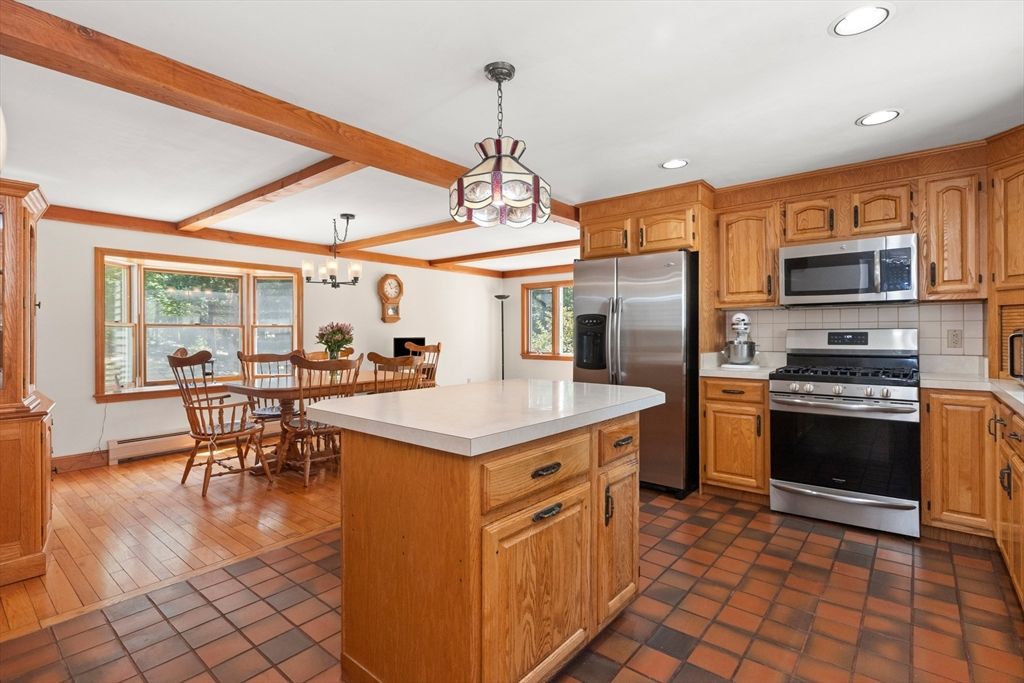 Chandelier, Dining room, Interior, Kitchen, Pendant Lights, Recessed Lighting, Stainless Steel Appliances, Wooden Beams, Wood Texture Flooring