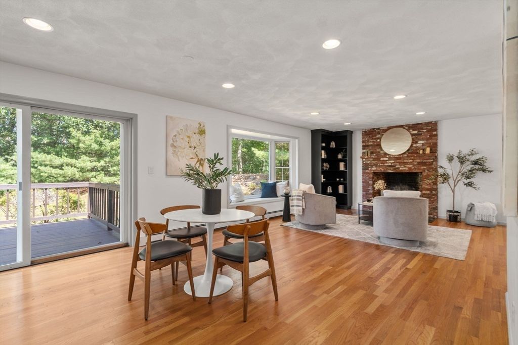 Dining room, Fireplace, Interior, Living room, Recessed Lighting, Stone Walls, Wood Texture Flooring