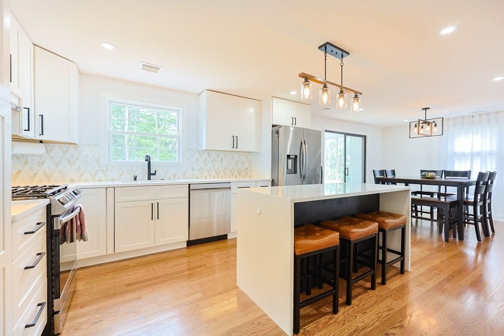Dining room, Interior, Kitchen, Pendant Lights, Recessed Lighting, Stainless Steel Appliances, Wood Texture Flooring