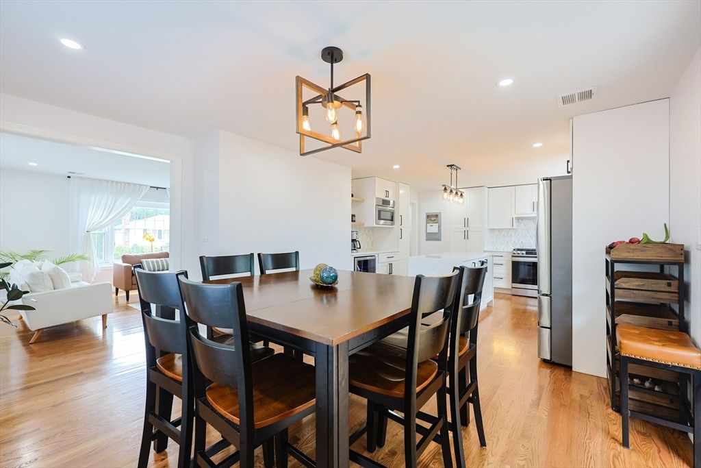 Dining room, Interior, Kitchen, Living room, Pendant Lights, Recessed Lighting, Stainless Steel Appliances, Wood Texture Flooring