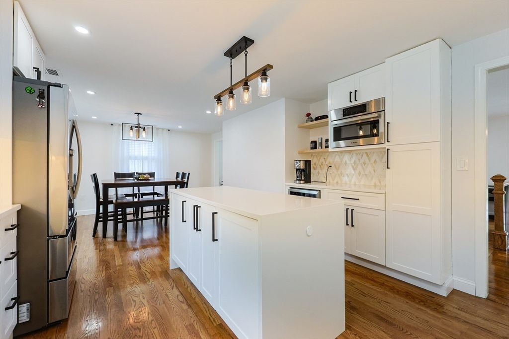 Dining room, Interior, Kitchen, Pendant Lights, Recessed Lighting, Stainless Steel Appliances, Wood Texture Flooring
