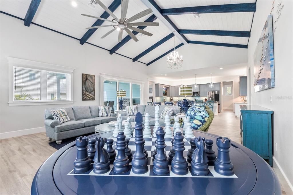 Chandelier, Interior, Kitchen, Living room, Pendant Lights, Recessed Lighting, Stainless Steel Appliances, Wood Texture Flooring
