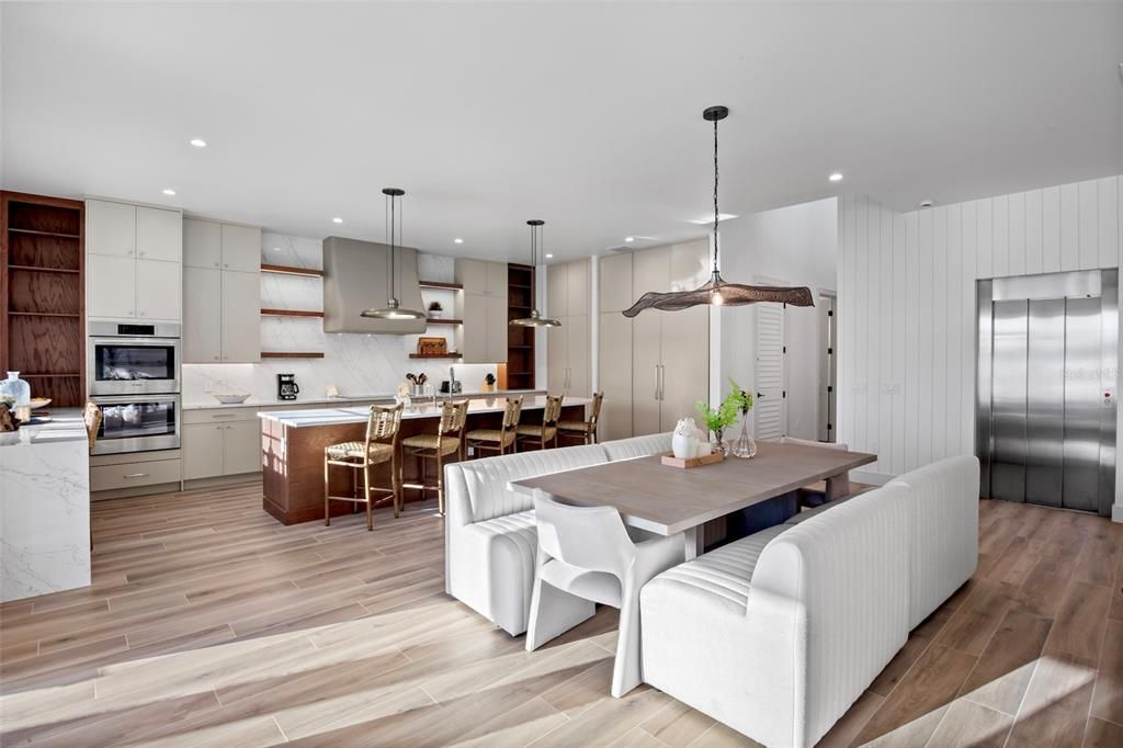 Dining room, Interior, Kitchen, Pendant Lights, Recessed Lighting, Stainless Steel Appliances, Wood Texture Flooring