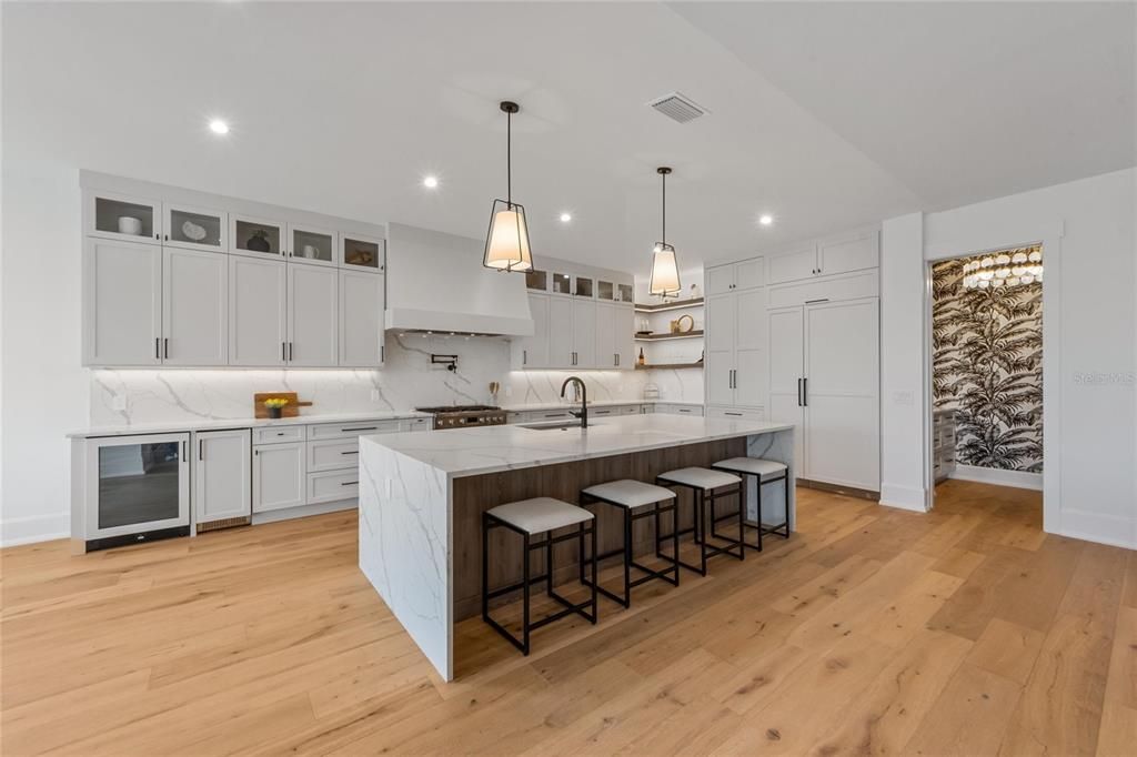 Interior, Kitchen, Marble Walls, Pendant Lights, Recessed Lighting, Wood Texture Flooring
