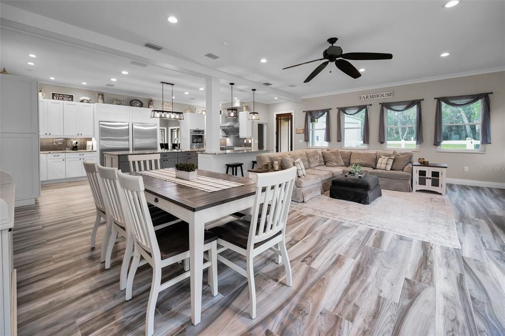 Dining room, Interior, Kitchen, Living room, Pendant Lights, Recessed Lighting, Stainless Steel Appliances, Wood Texture Flooring