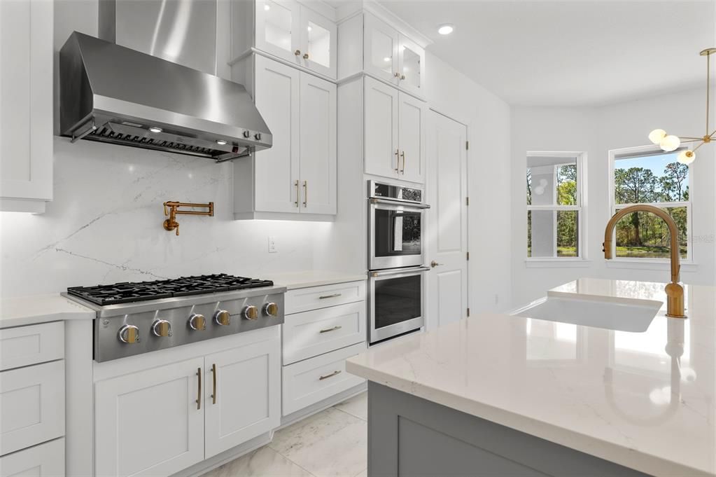 Interior, Kitchen, Marble, Marble Walls, Pendant Lights, Recessed Lighting, Stainless Steel Appliances
