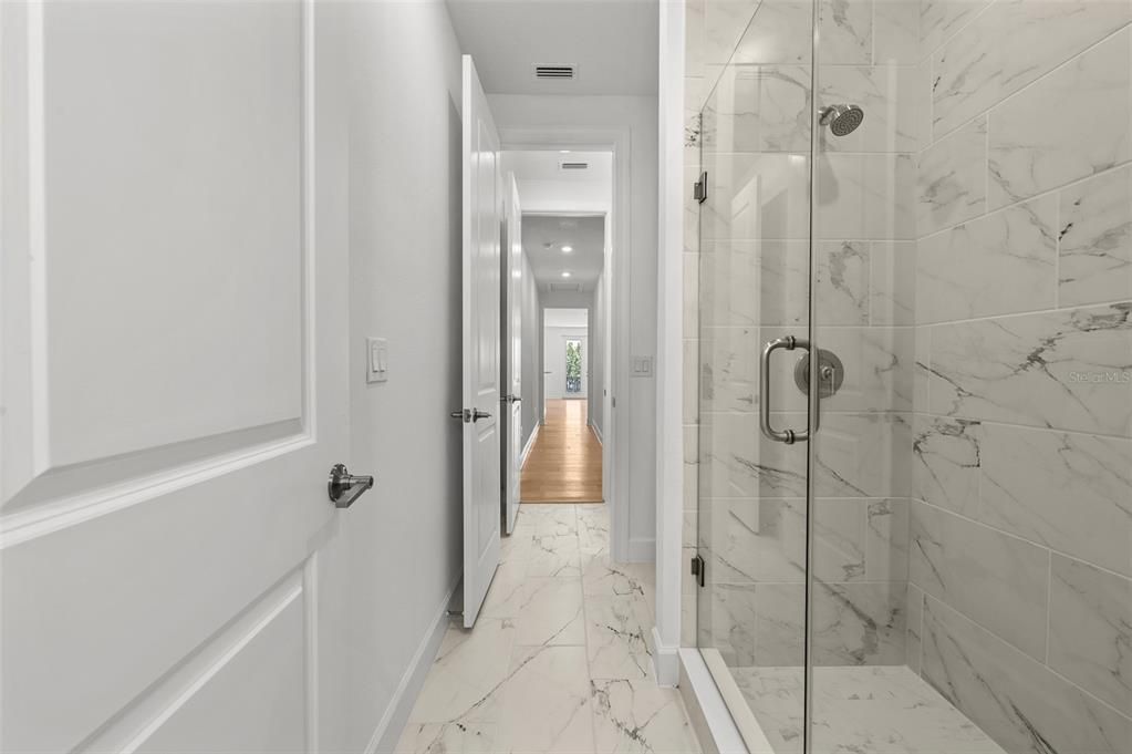 Bathroom, Glass Shower, Interior, Marble, Marble Walls, Recessed Lighting, Wood Texture Flooring