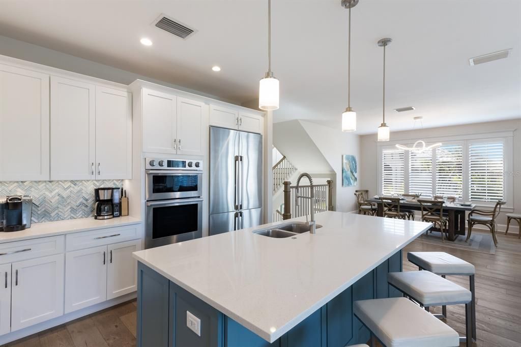 Dining room, Interior, Kitchen, Pendant Lights, Recessed Lighting, Stainless Steel Appliances, Wood Texture Flooring
