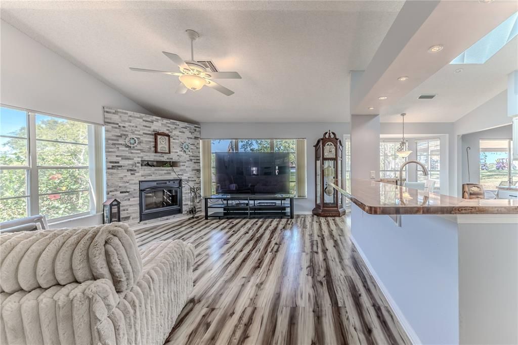 Fireplace, Interior, Pendant Lights, Recessed Lighting, Stone Walls, Wood Texture Flooring
