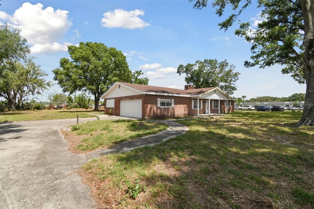 Attached, Backyard, Exterior, Facade, Brick Facade, Ranch