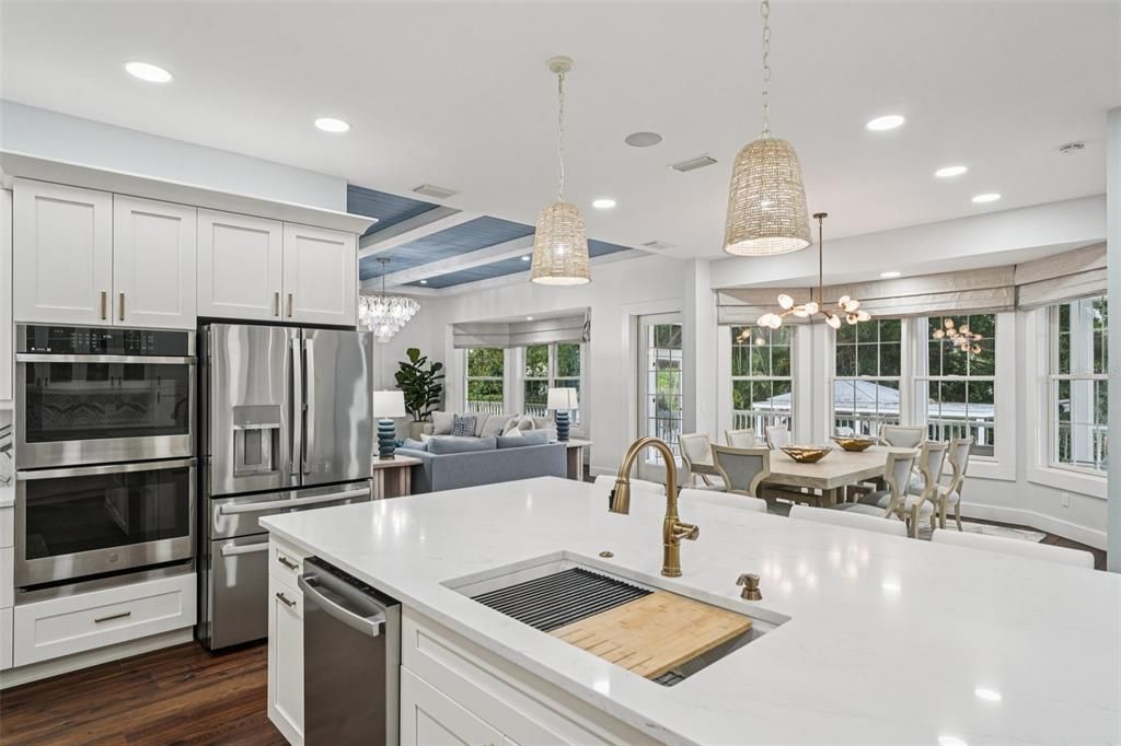 Chandelier, Dining room, Interior, Kitchen, Living room, Pendant Lights, Recessed Lighting, Stainless Steel Appliances, Wood Texture Flooring