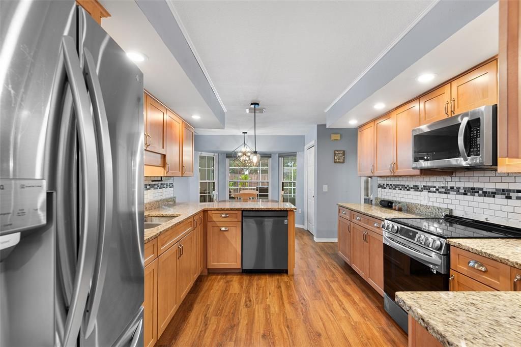 Chandelier, Interior, Kitchen, Pendant Lights, Recessed Lighting, Stainless Steel Appliances, Wood Texture Flooring