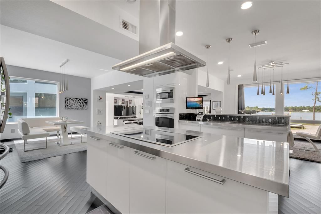 Dining room, Interior, Kitchen, Pendant Lights, Recessed Lighting, Stainless Steel Appliances, Water, Wood Texture Flooring
