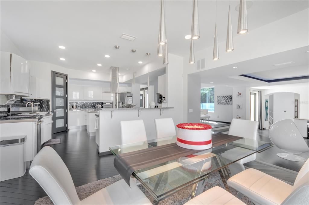 Dining room, Interior, Kitchen, Pendant Lights, Recessed Lighting, Stainless Steel Appliances, Wood Texture Flooring