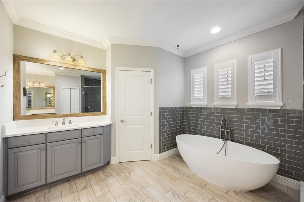 Bathroom, Dual Sink Vanities, Free Standing Baths, Interior, Recessed Lighting, Wood Texture Flooring