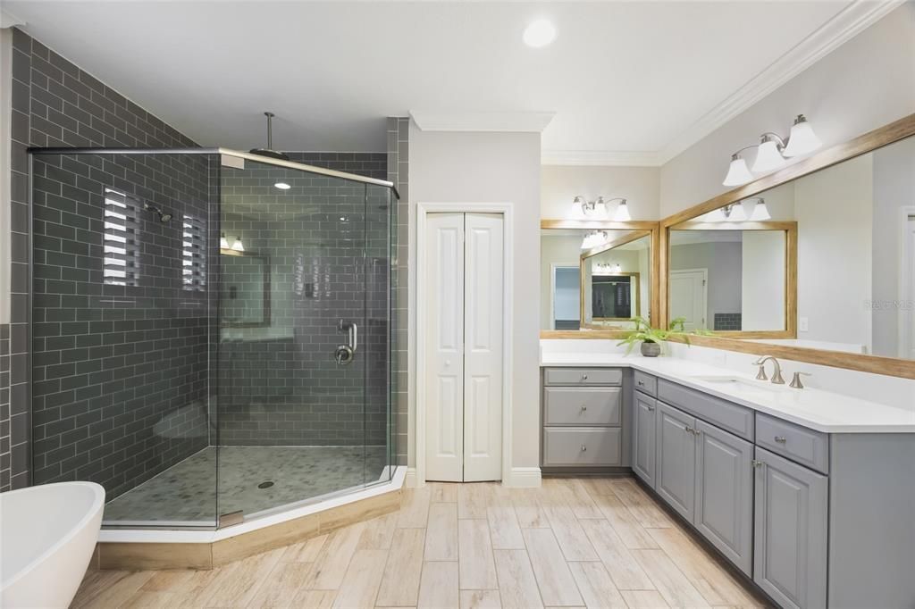 Bathroom, Dual Sink Vanities, Glass Shower, Interior, Recessed Lighting, Wood Texture Flooring