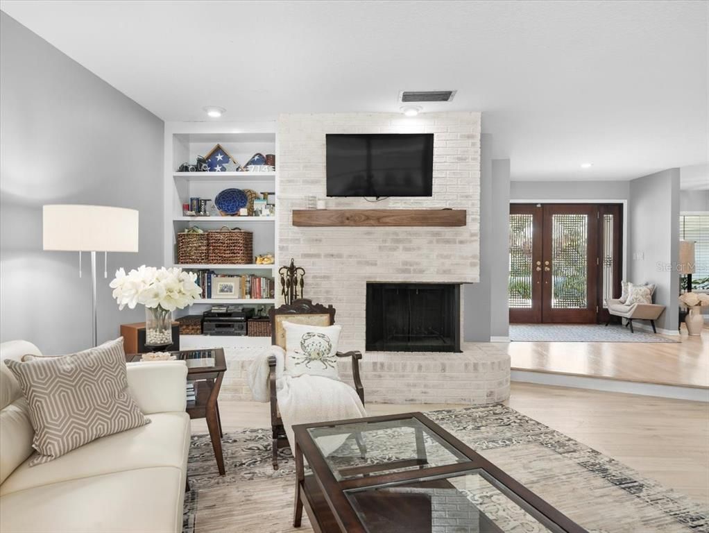 Fireplace, Interior, Living room, Recessed Lighting, Stone Walls, Wood Texture Flooring