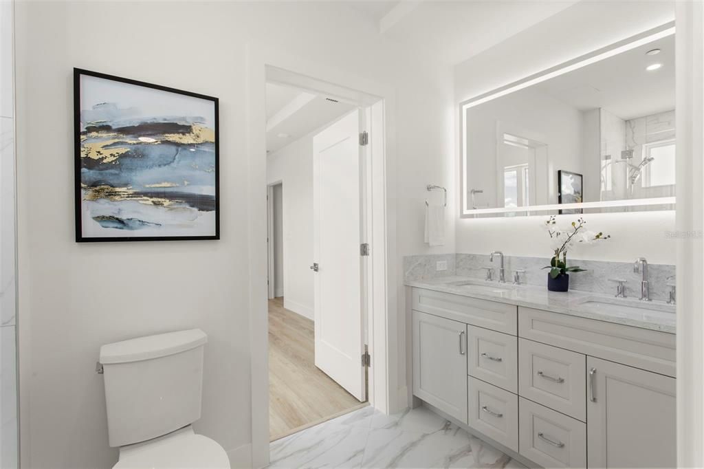 Bathroom, Dual Sink Vanities, Interior, Marble, Recessed Lighting, Wood Texture Flooring